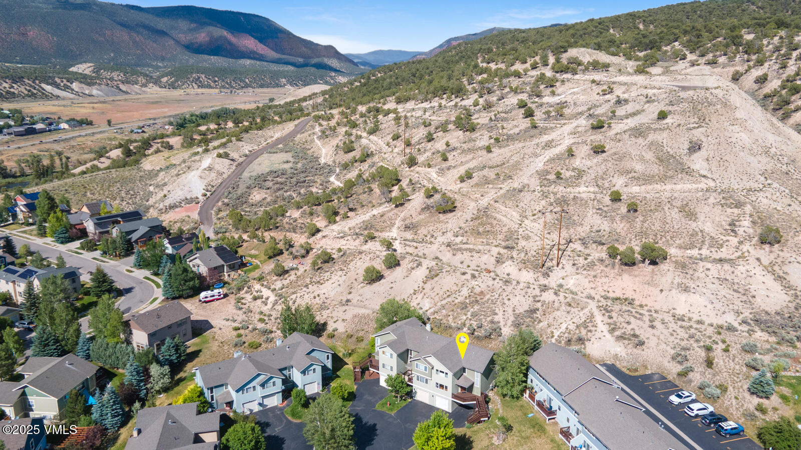 60 Mill Road, Unit J1 Eagle, CO 81631 - Photo 27 of 31 a view of a city with mountains in the background
