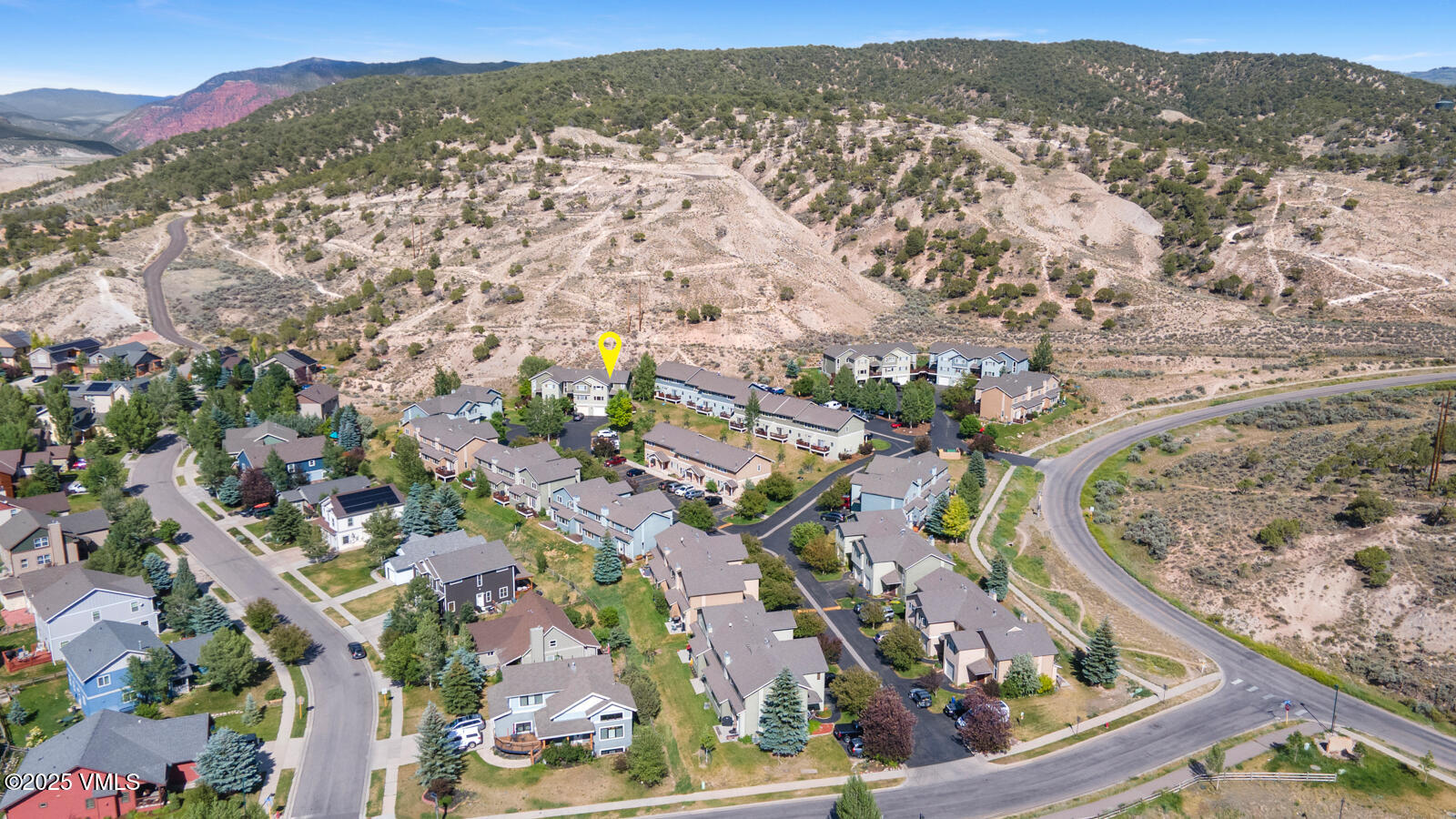 60 Mill Road, Unit J1 Eagle, CO 81631 - Photo 30 of 31 an aerial view of residential houses with outdoor space