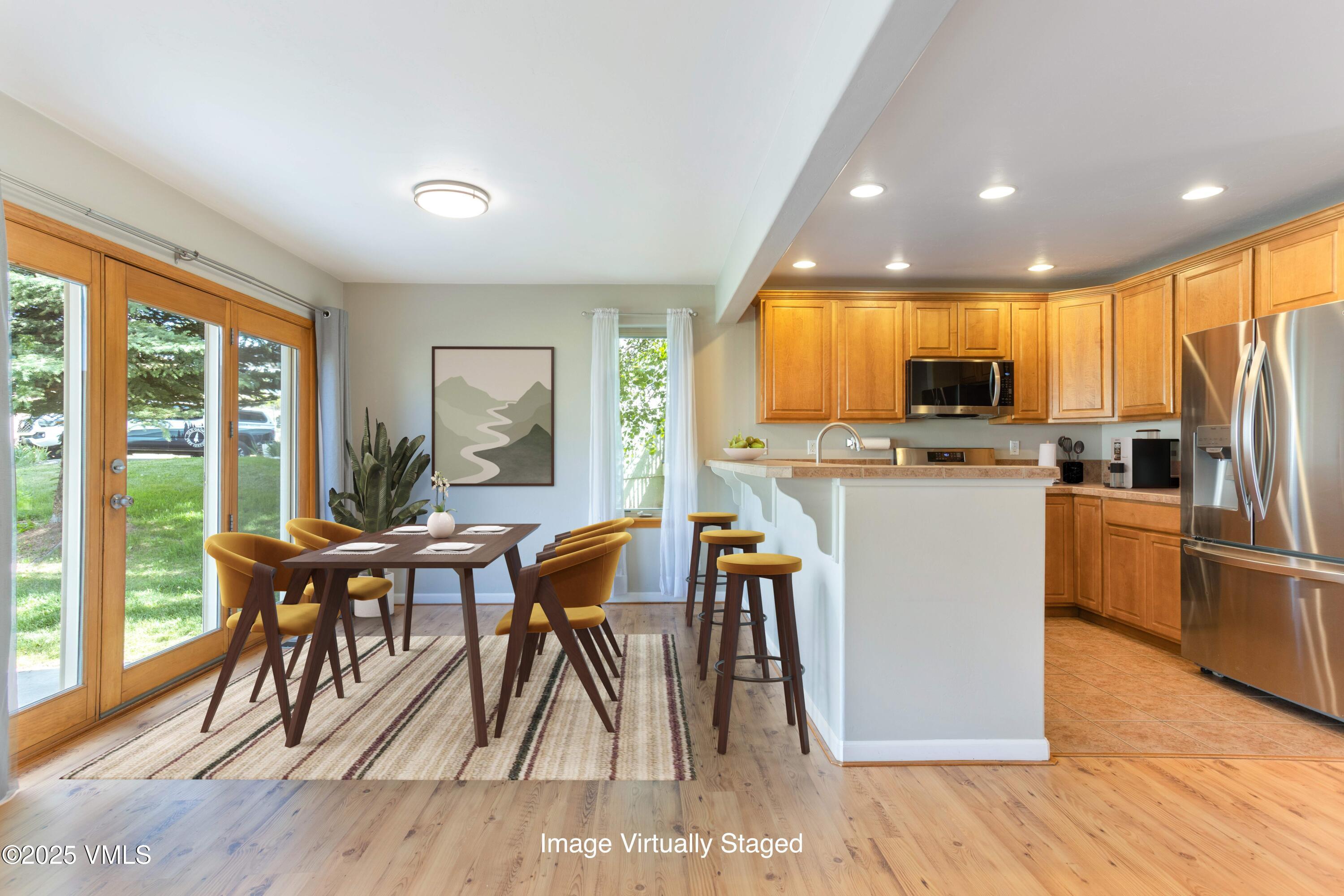 60 Mill Road, Unit J1 Eagle, CO 81631 - Photo 5 of 31 a view of a dining room with furniture window and outside view