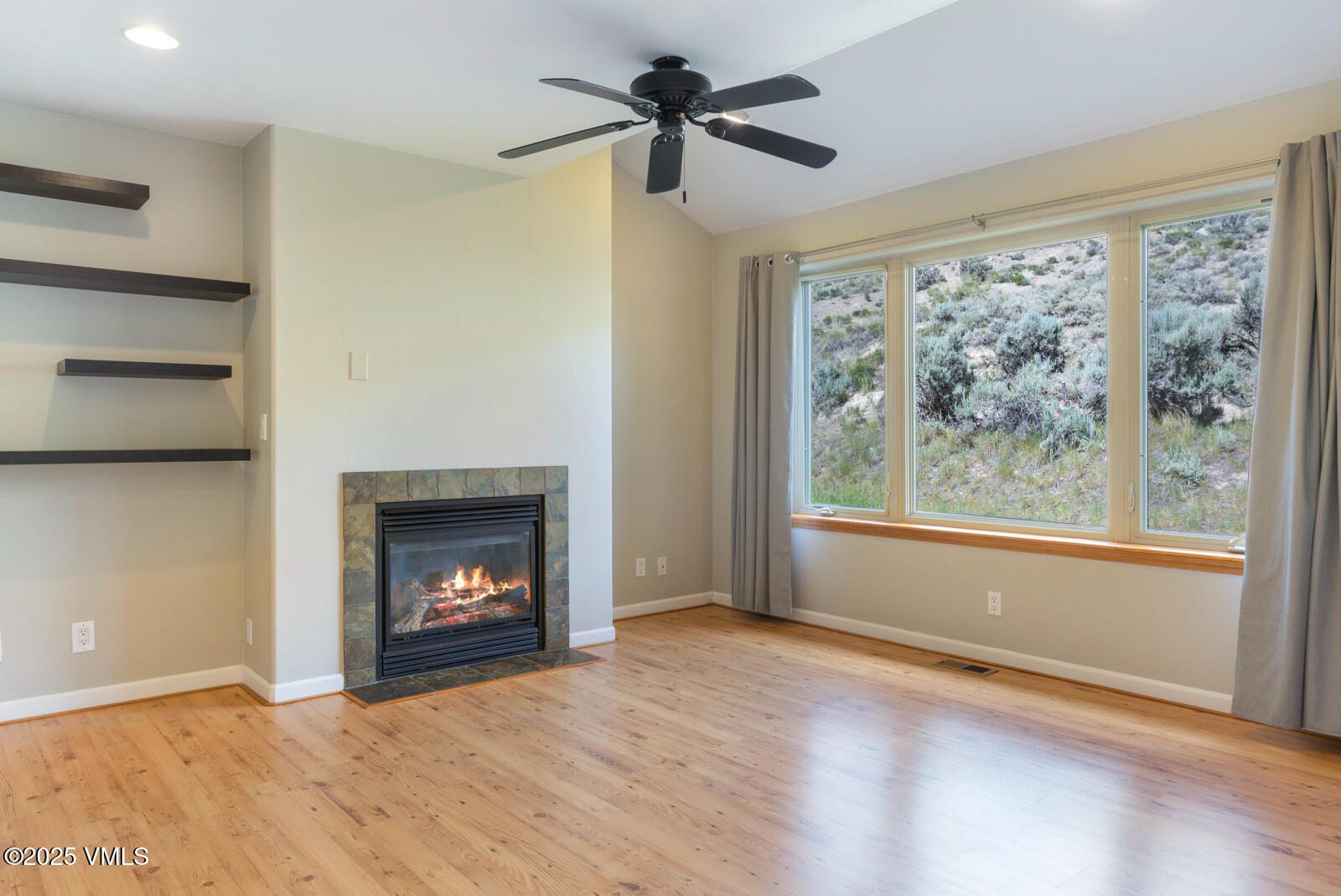 60 Mill Road, Unit J1 Eagle, CO 81631 - Photo 10 of 31 a view of an empty room with a window and fireplace