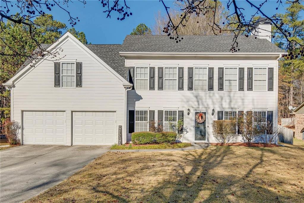 535 Hunnicutt Road Southeast Mableton, GA 30126 - Photo 1 of 1 a front view of a house with a yard