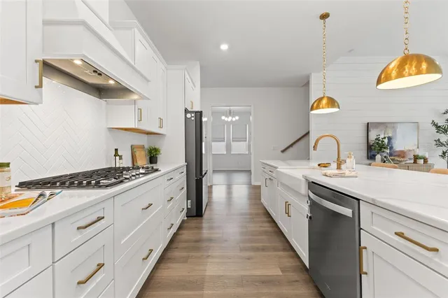 a large kitchen with stainless steel appliances kitchen island granite countertop a large center island attached withe living room