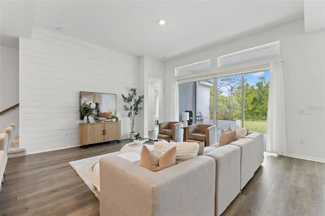 a view of a hallway view with wooden floor and staircase