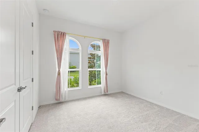 an empty room with white walls and white walls