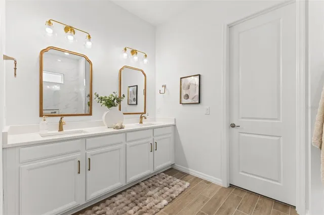a bathroom with a sink toilet tub and shower