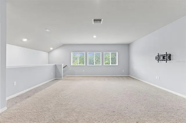 an aerial view of a house with a garden
