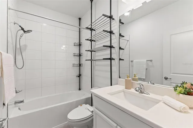 an aerial view of a house with a lake view