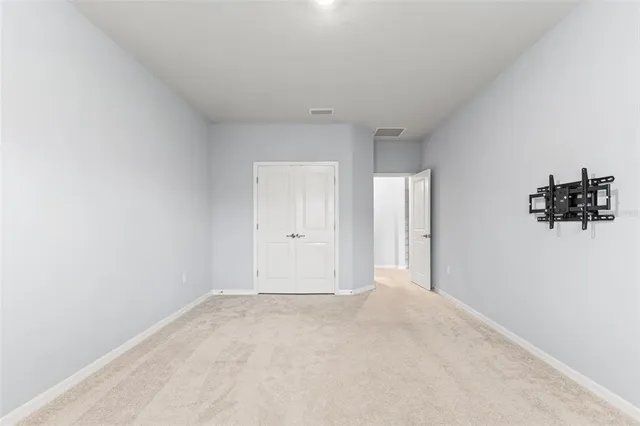 an aerial view of a house with a lake view