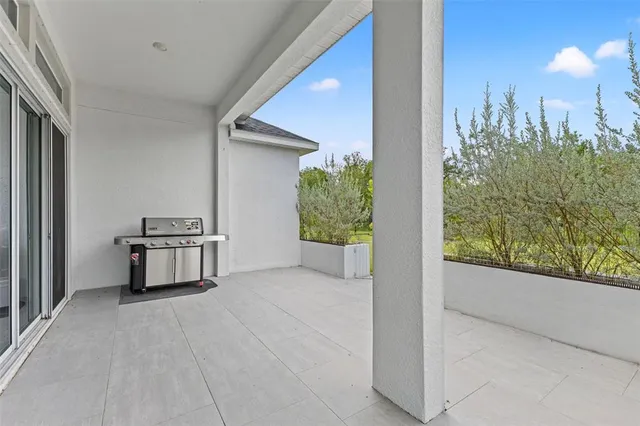a living room kitchen with furniture and kitchen view