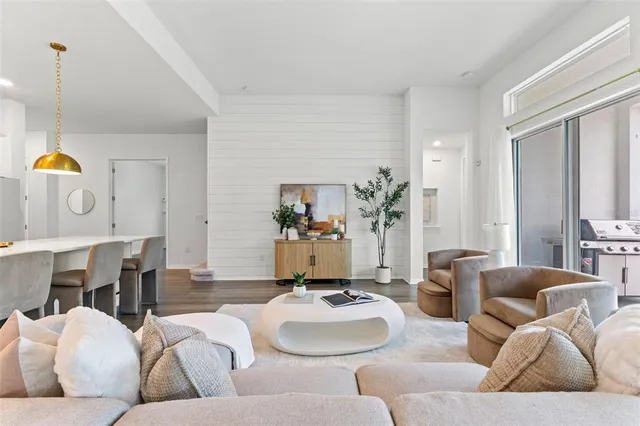 a large kitchen with stainless steel appliances granite countertop a stove and a sink
