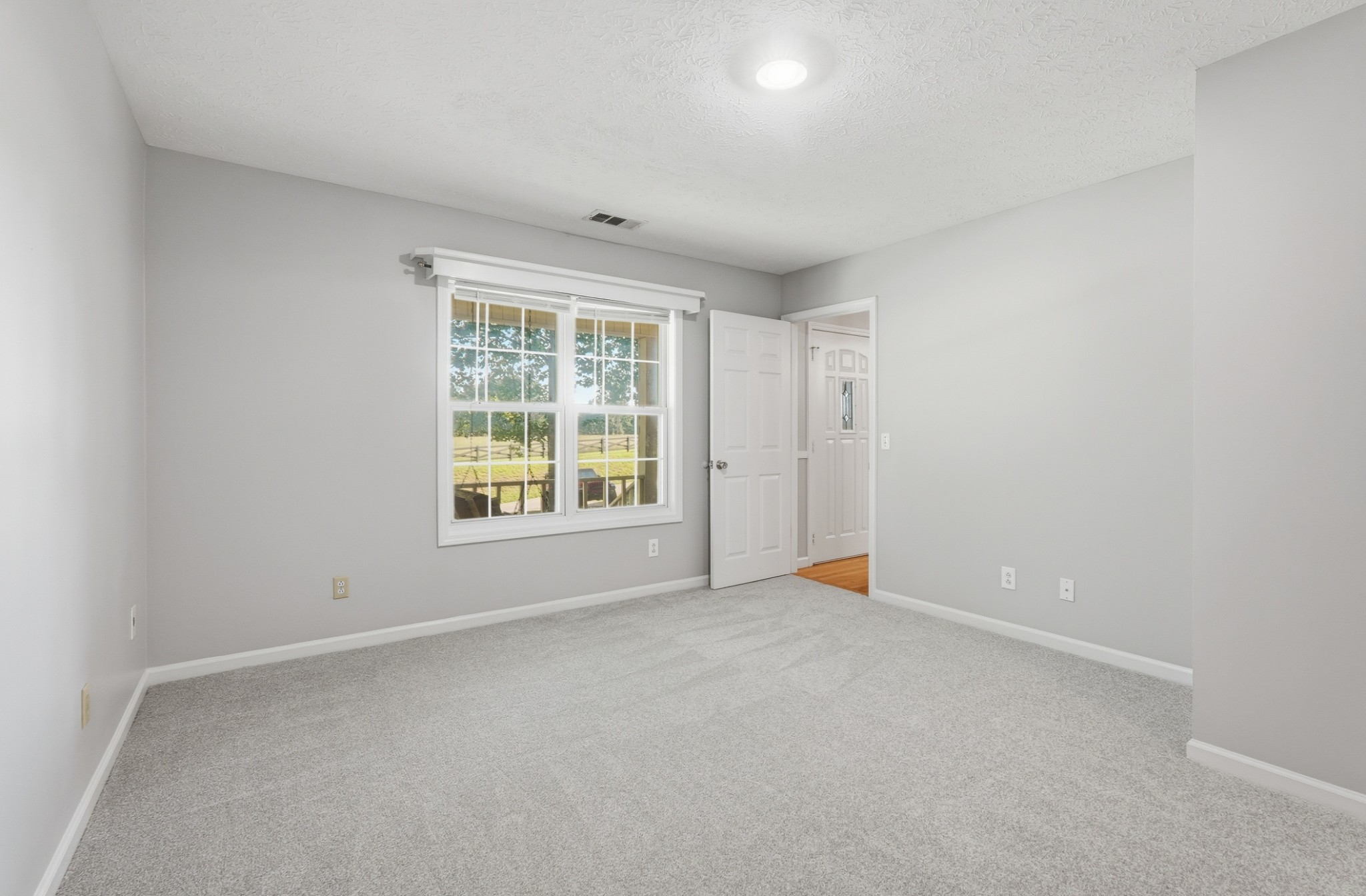 4877 Swafford Road Cookeville, TN 38501 - Photo 19 of 28 an empty room with windows