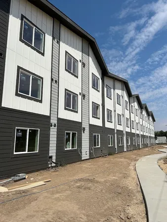 a front view of a building with many windows