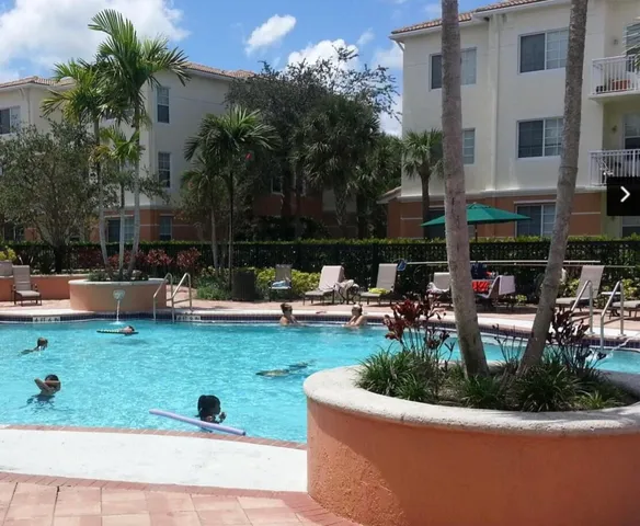 a view of a swimming pool with a patio