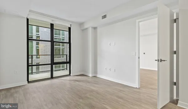 a view of a hallway with washer and dryer
