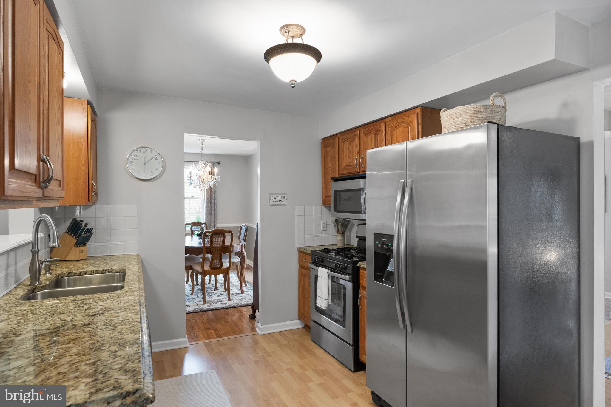 179 Forge Road Delran, NJ 08075 - Photo 11 of 35 a kitchen with stainless steel appliances granite countertop a refrigerator and a stove top oven