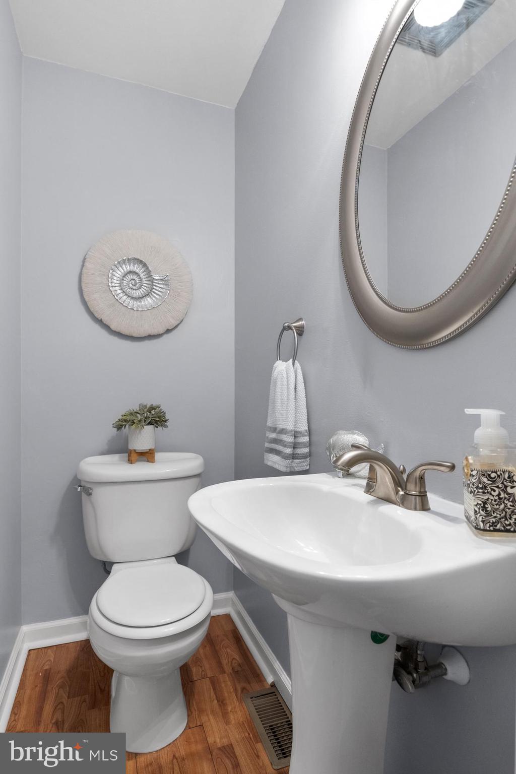179 Forge Road Delran, NJ 08075 - Photo 19 of 35 a bathroom with a sink a toilet and a mirror
