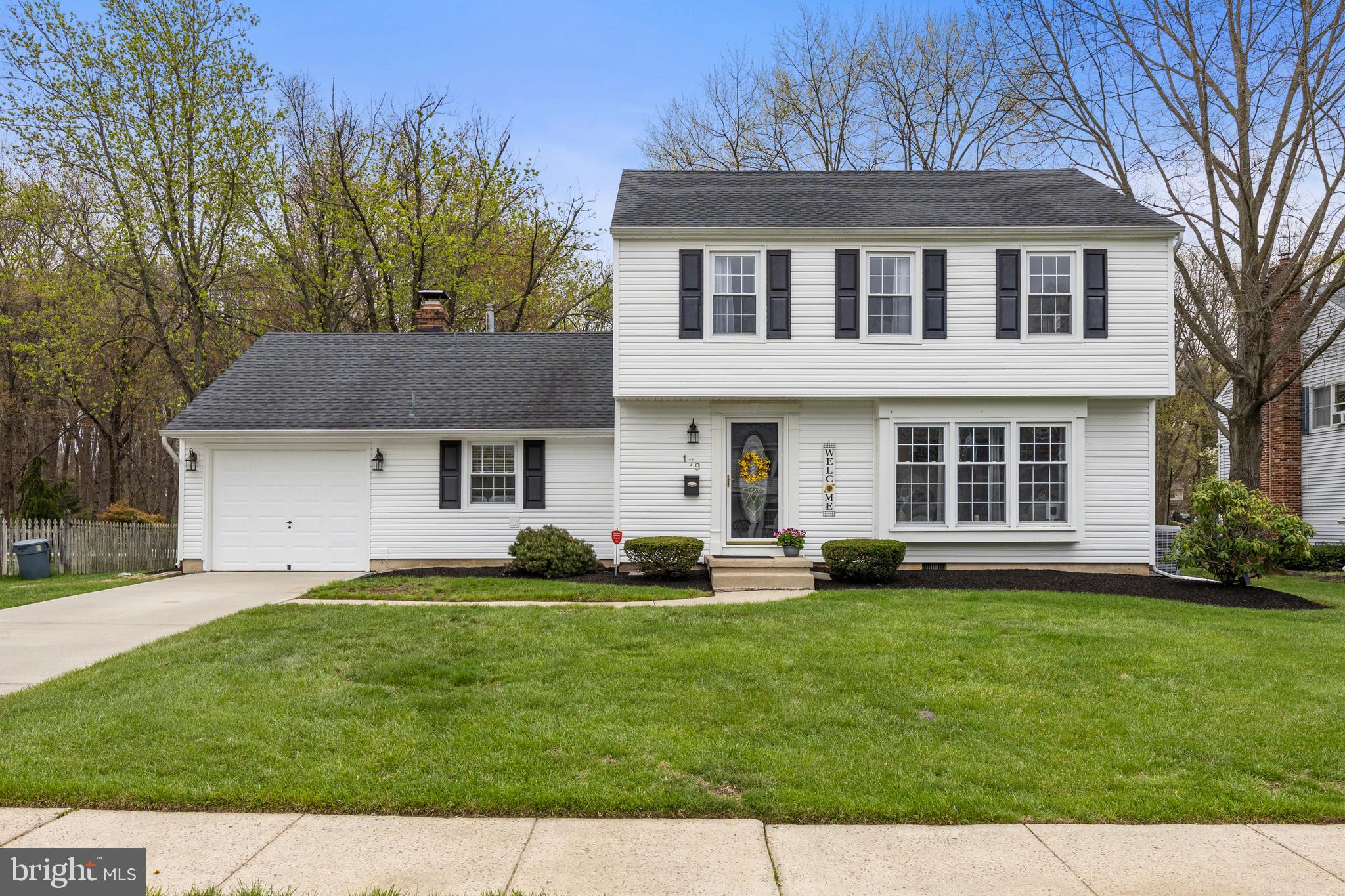179 Forge Road Delran, NJ 08075 - Photo 2 of 35 a front view of a house with a yard and trees