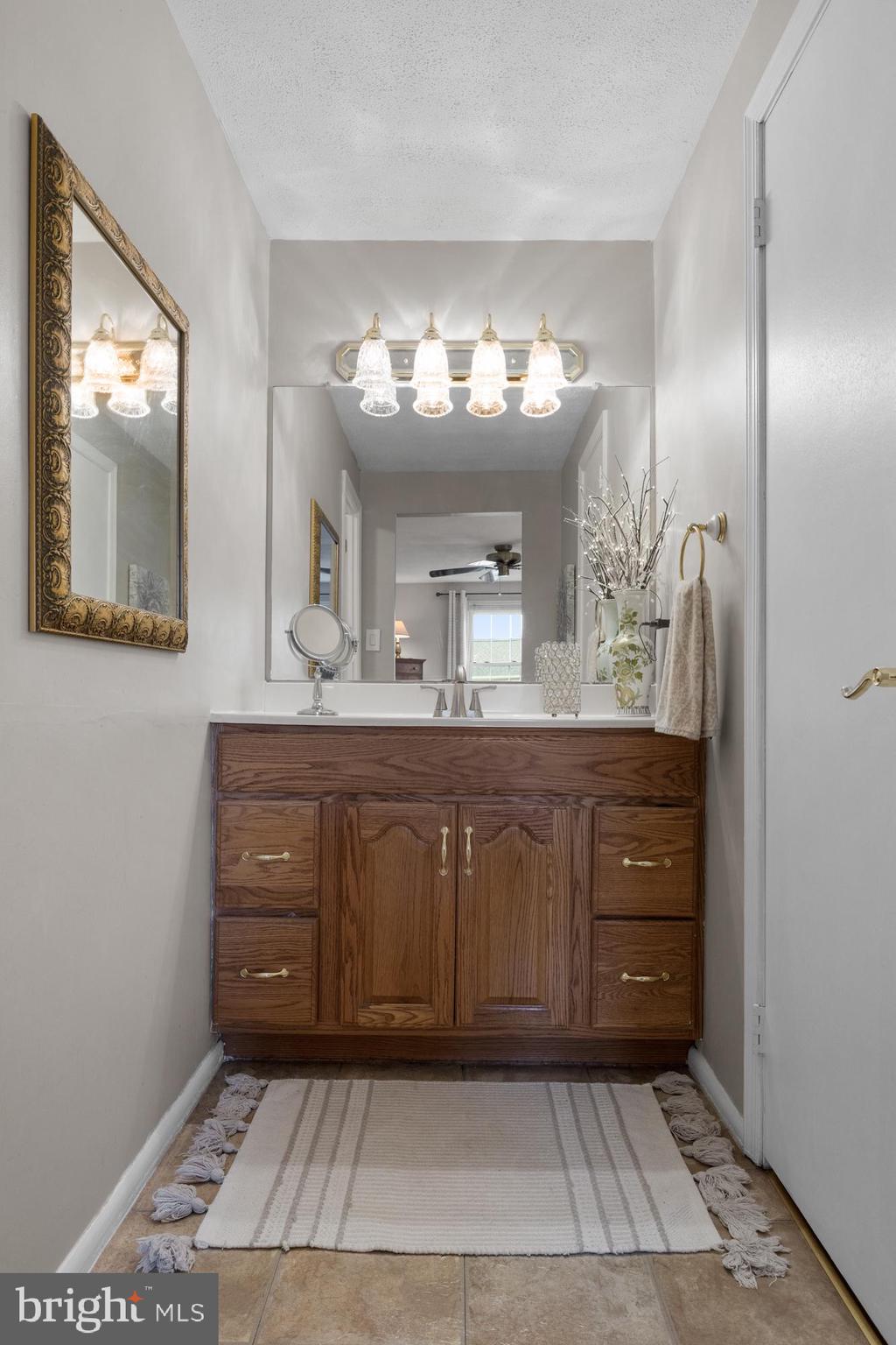 179 Forge Road Delran, NJ 08075 - Photo 23 of 35 a bathroom with a sink and a mirror