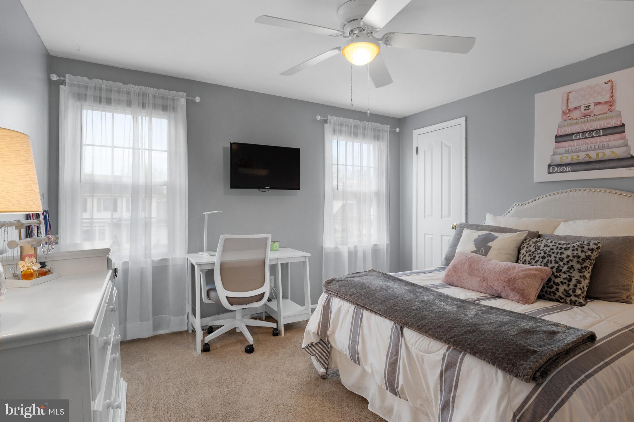 179 Forge Road Delran, NJ 08075 - Photo 26 of 35 a bedroom with a bed a chair and a chandelier