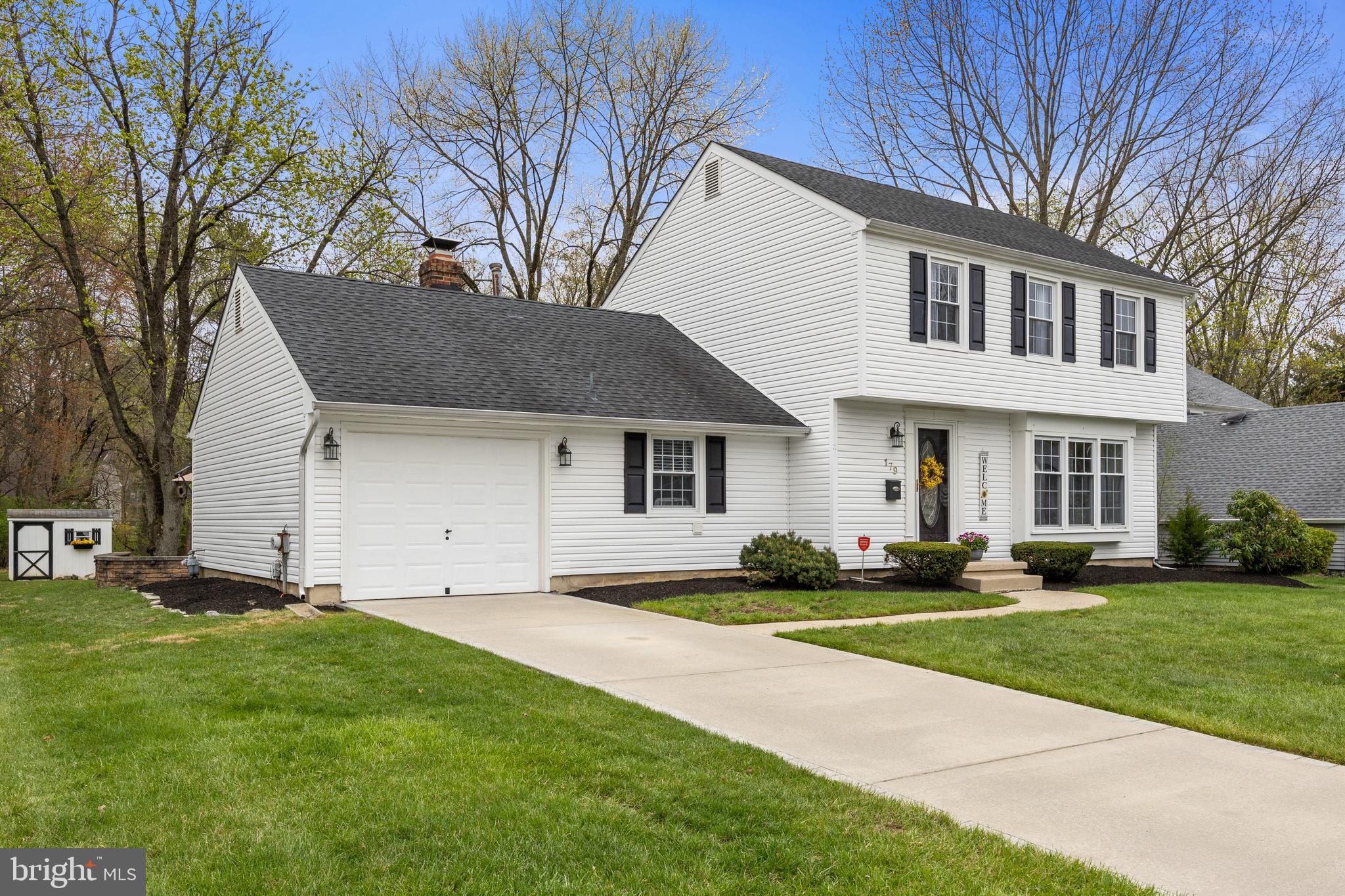 179 Forge Road Delran, NJ 08075 - Photo 3 of 35 a front view of a house with a yard and trees