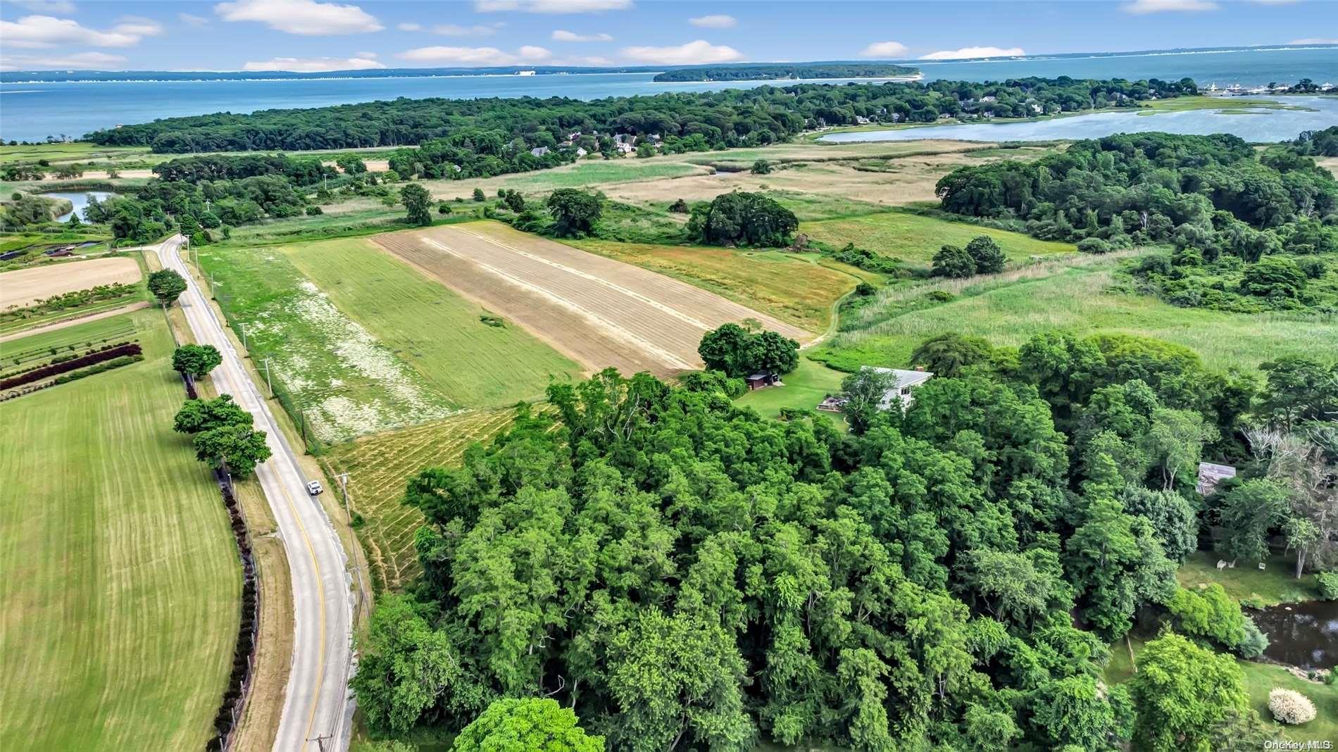 2050 New Suffolk Road Cutchogue, NY 11935 - Photo 1 of 1 a view of a lake with a yard