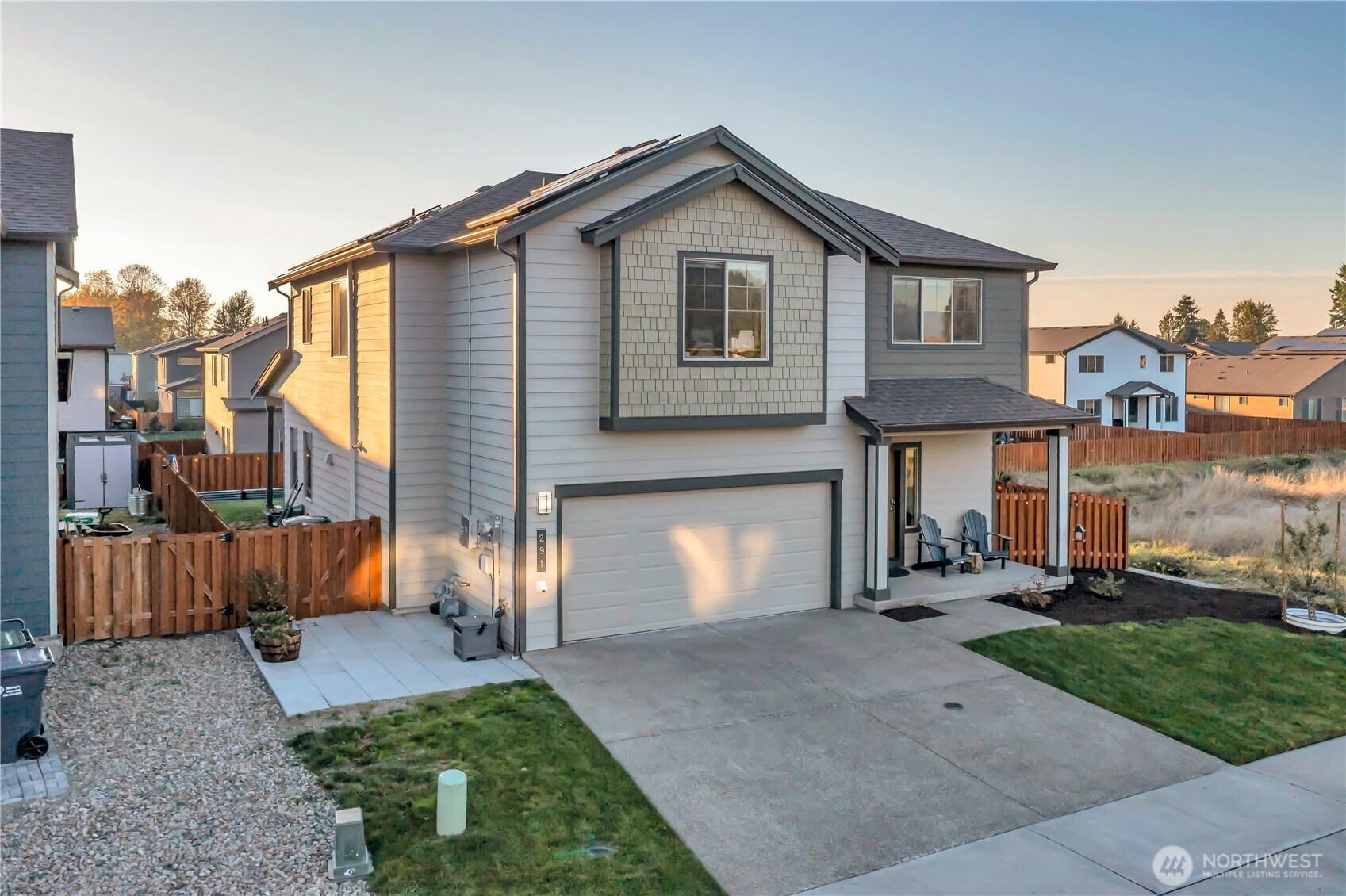 291 South Sergeant Street Buckley, WA 98321 - Photo 2 of 38 a front view of a house with a yard and garage