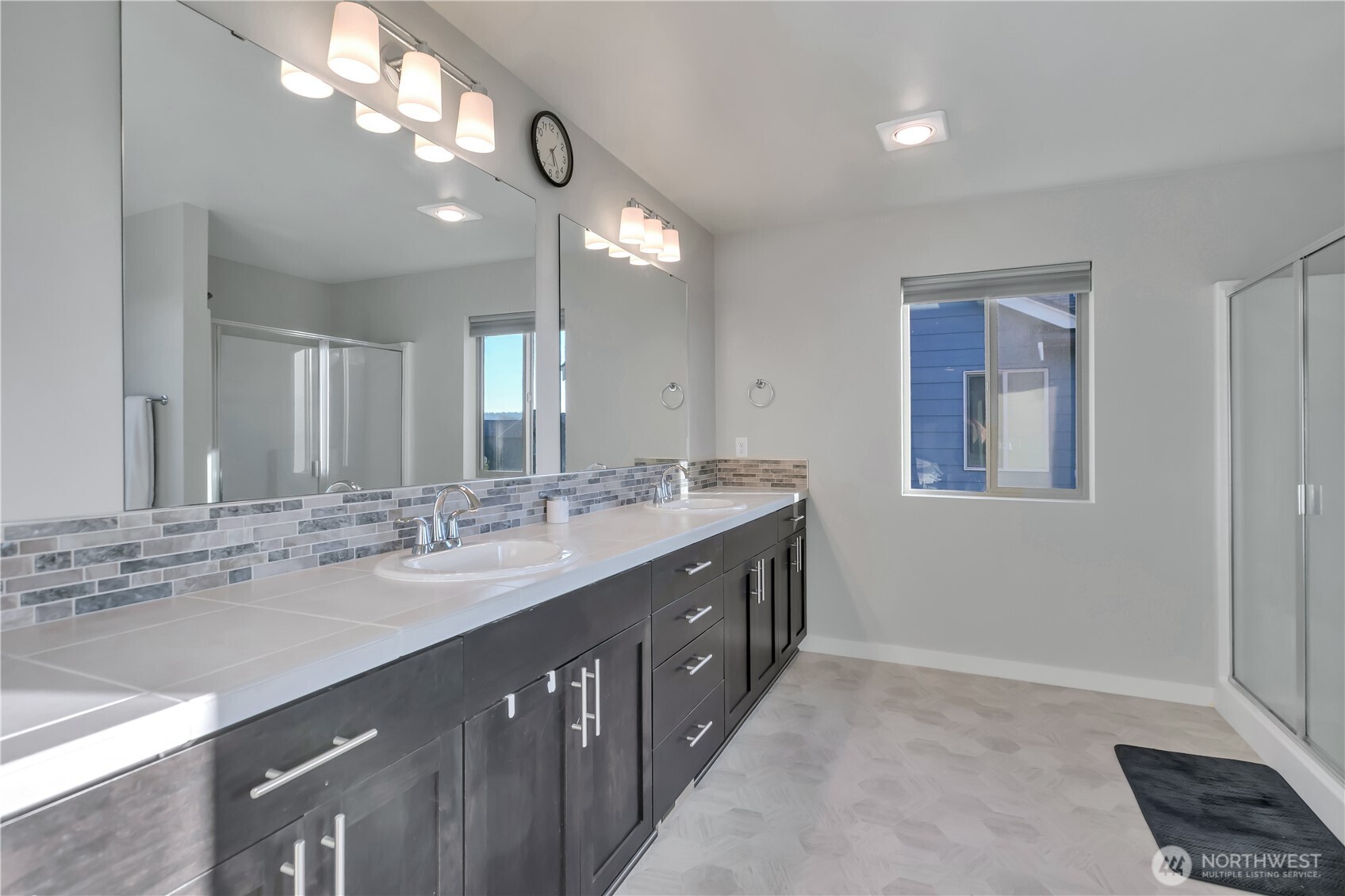 291 South Sergeant Street Buckley, WA 98321 - Photo 22 of 38 a bathroom with a double vanity sink and a mirror