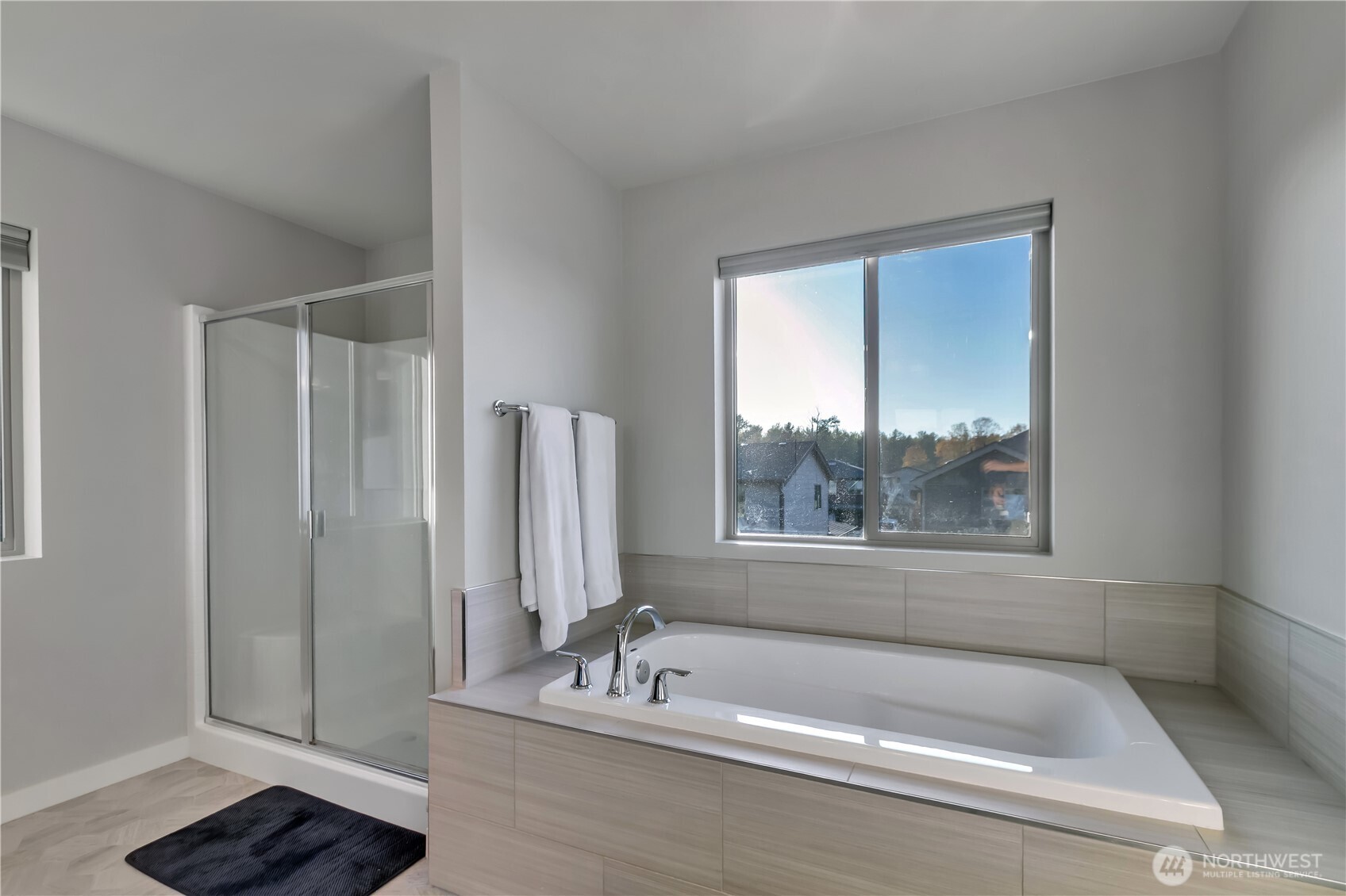 291 South Sergeant Street Buckley, WA 98321 - Photo 23 of 38 a bathroom with a tub a window and a shower