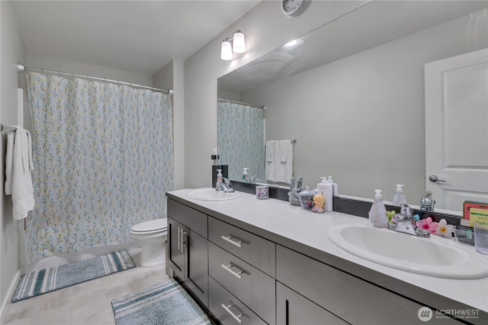 291 South Sergeant Street Buckley, WA 98321 - Photo 25 of 38 a bathroom with a double vanity sink toilet and a shower