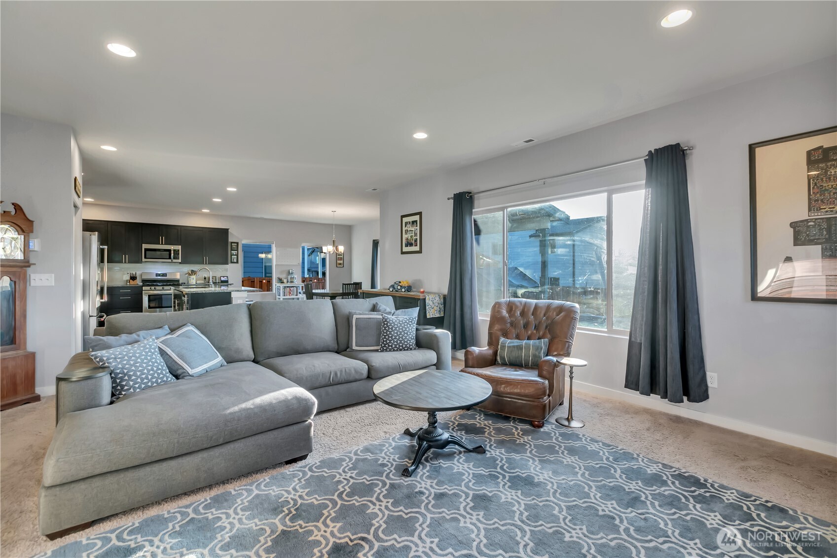 291 South Sergeant Street Buckley, WA 98321 - Photo 6 of 38 a living room with furniture and a view of kitchen