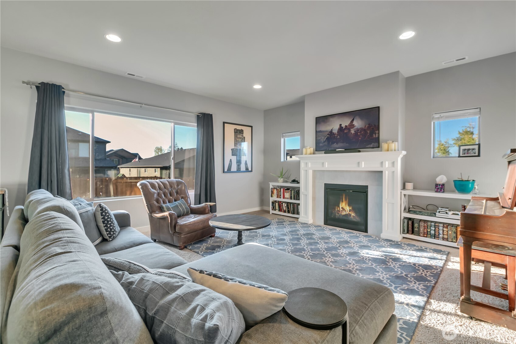 291 South Sergeant Street Buckley, WA 98321 - Photo 8 of 38 a living room with furniture large window and a fireplace