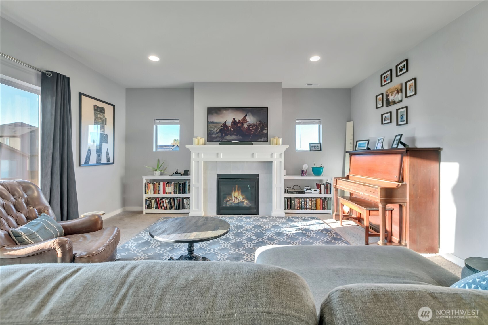 291 South Sergeant Street Buckley, WA 98321 - Photo 9 of 38 a living room with furniture and a fireplace