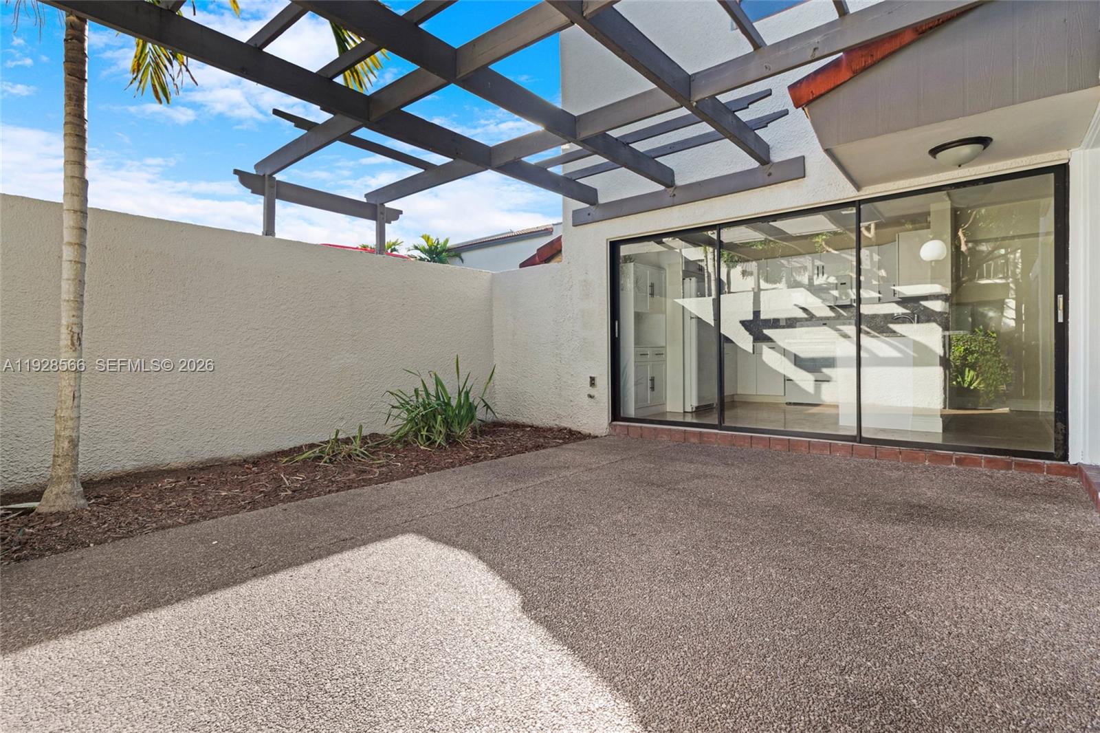 4714 Southwest 67th Avenue, Unit C1 Miami, FL 33155 - Photo 13 of 37 a view of a room with wooden walls