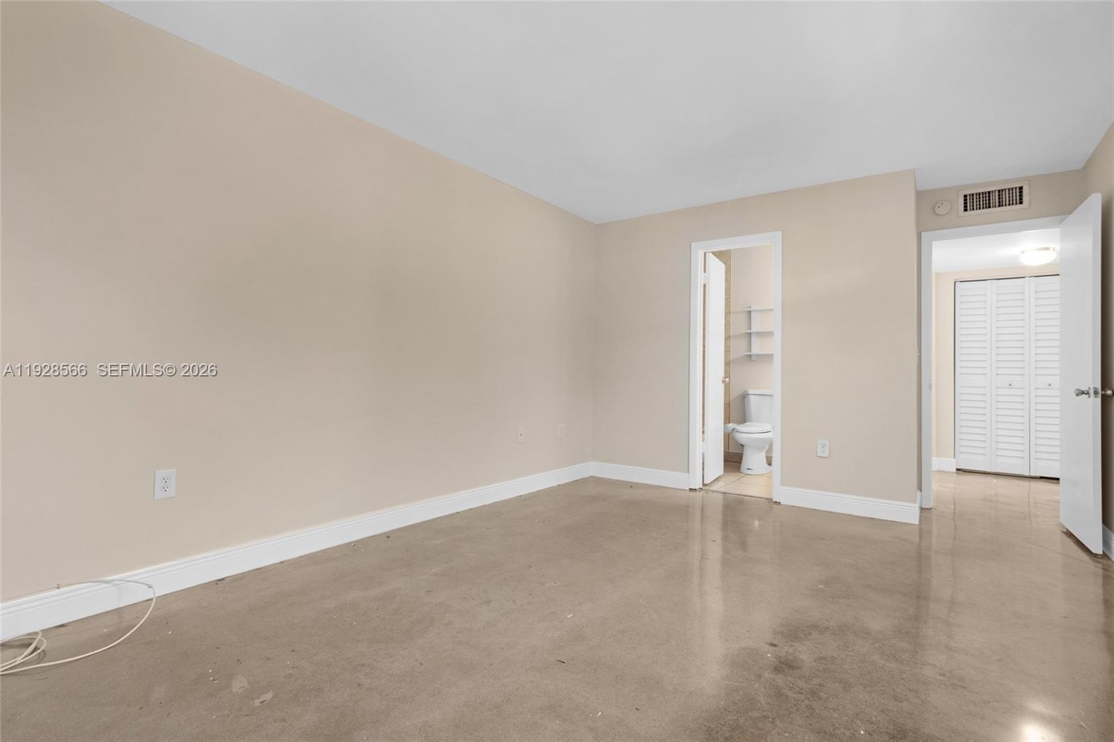4714 Southwest 67th Avenue, Unit C1 Miami, FL 33155 - Photo 21 of 37 an empty room with an entryway