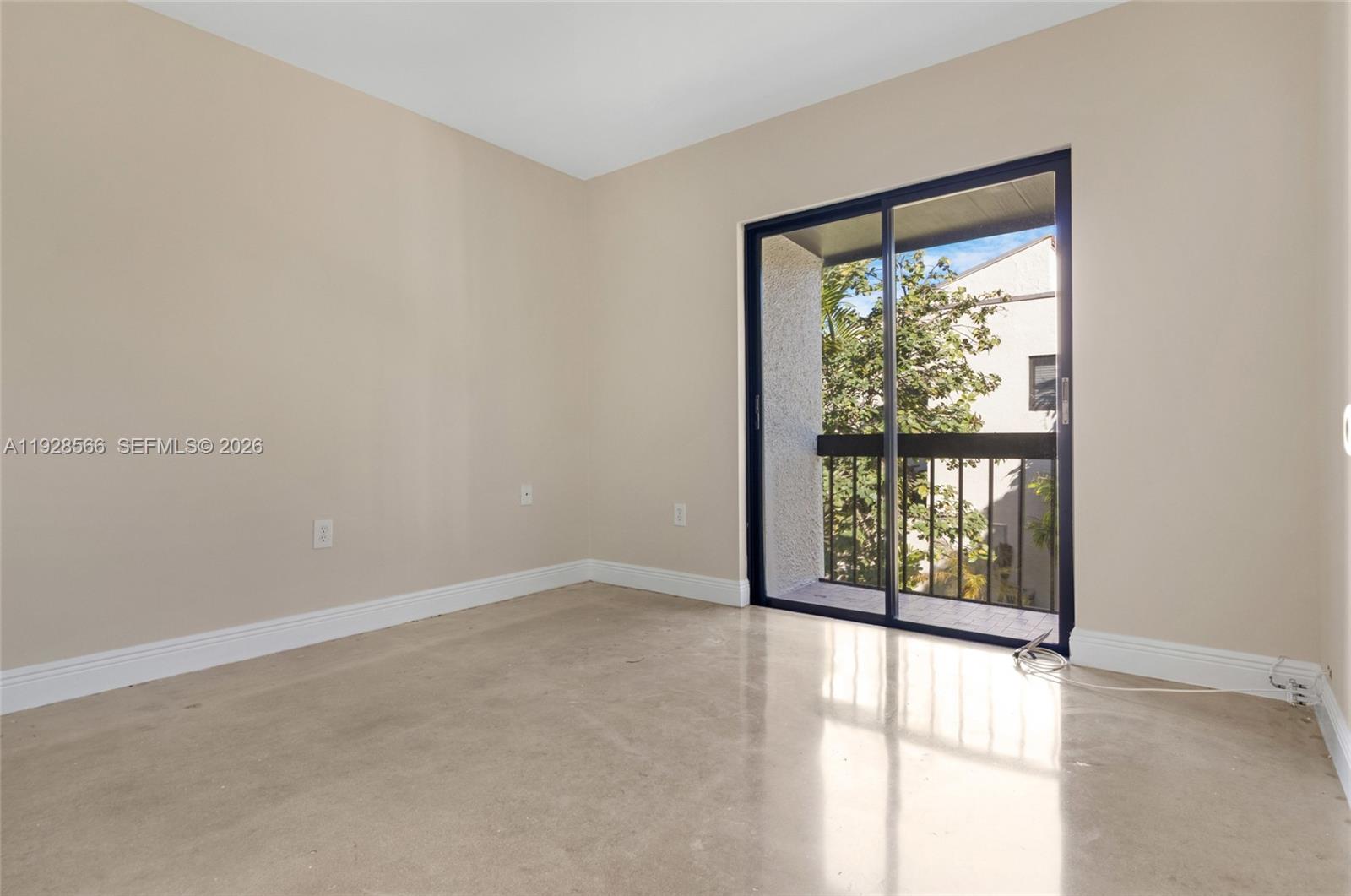 4714 Southwest 67th Avenue, Unit C1 Miami, FL 33155 - Photo 24 of 37 an empty room with a window