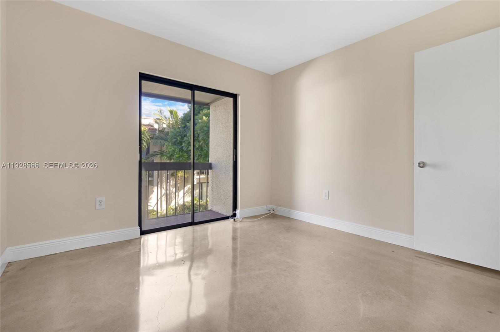 4714 Southwest 67th Avenue, Unit C1 Miami, FL 33155 - Photo 25 of 37 a view of an empty room with a window