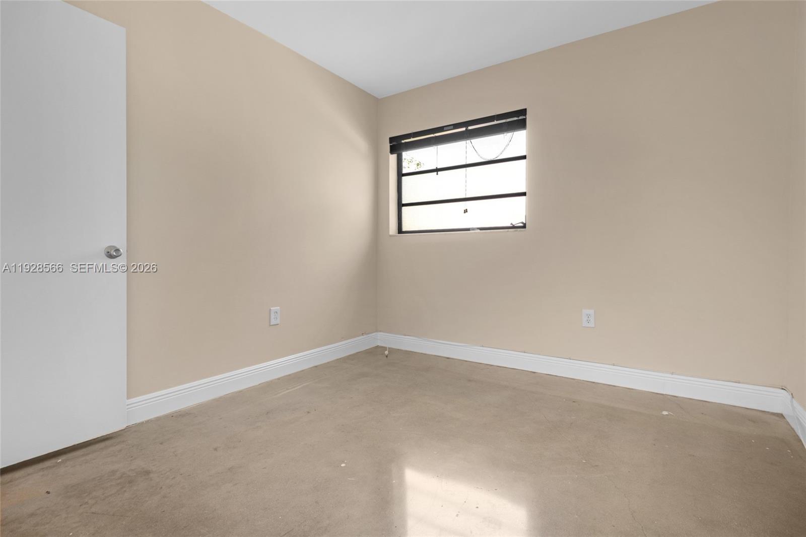 4714 Southwest 67th Avenue, Unit C1 Miami, FL 33155 - Photo 28 of 37 an empty room with windows