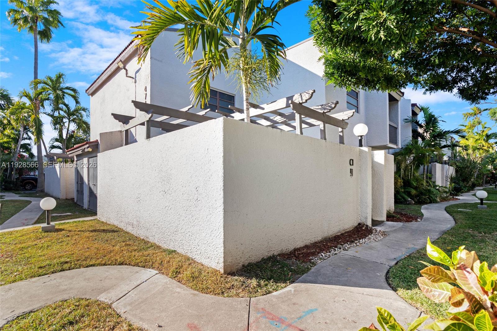 4714 Southwest 67th Avenue, Unit C1 Miami, FL 33155 - Photo 34 of 37 a view of backyard with swimming pool and furniture