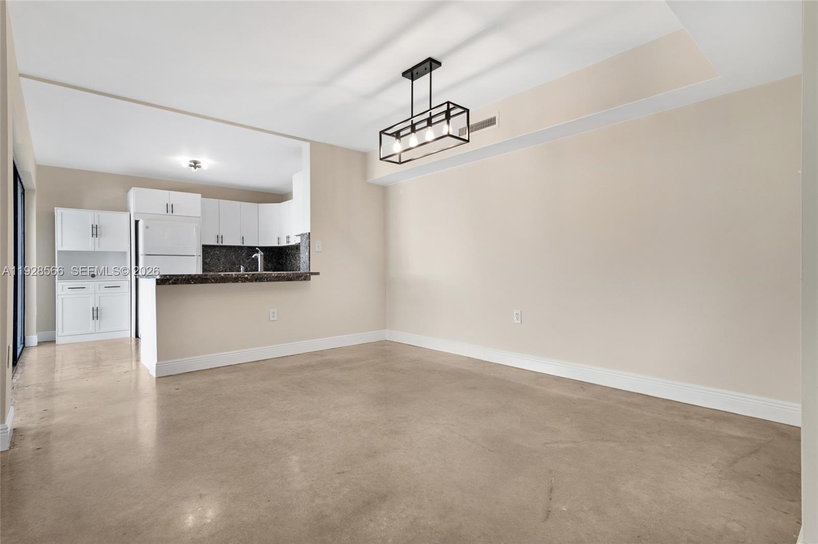 4714 Southwest 67th Avenue, Unit C1 Miami, FL 33155 - Photo 6 of 37 a view of a kitchen with a sink and a refrigerator