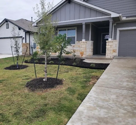 a house view with a garden space
