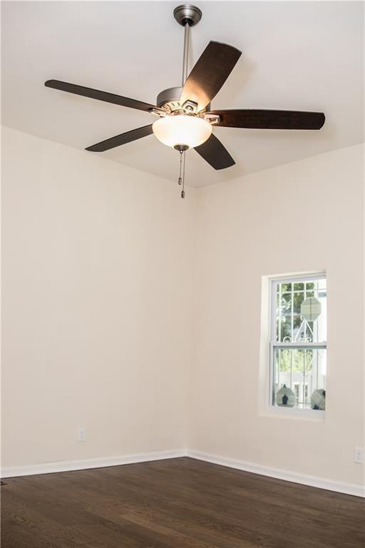 911 Smith Street Southwest Atlanta, GA 30310 - Photo 10 of 13 a view of a room with wooden floor and fan