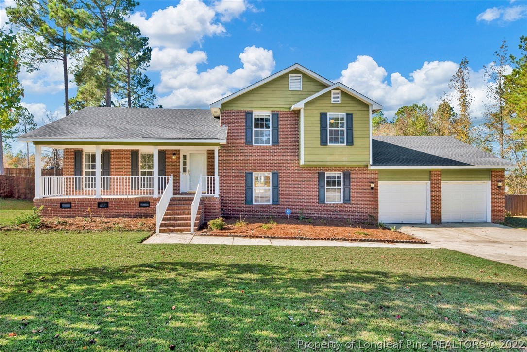365 Sawyer Road Cameron, NC 28326 - Photo 1 of 37 a front view of a house with a yard