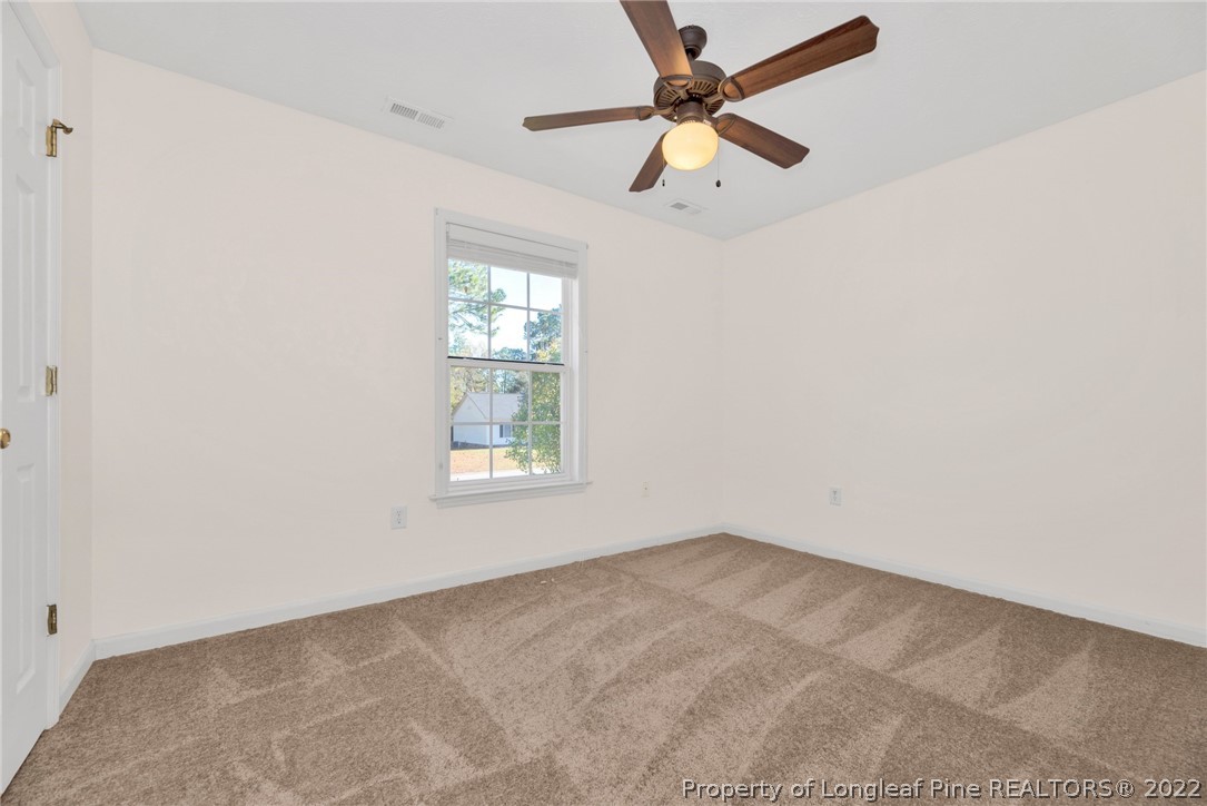 365 Sawyer Road Cameron, NC 28326 - Photo 27 of 37 an empty room with a window and a fan