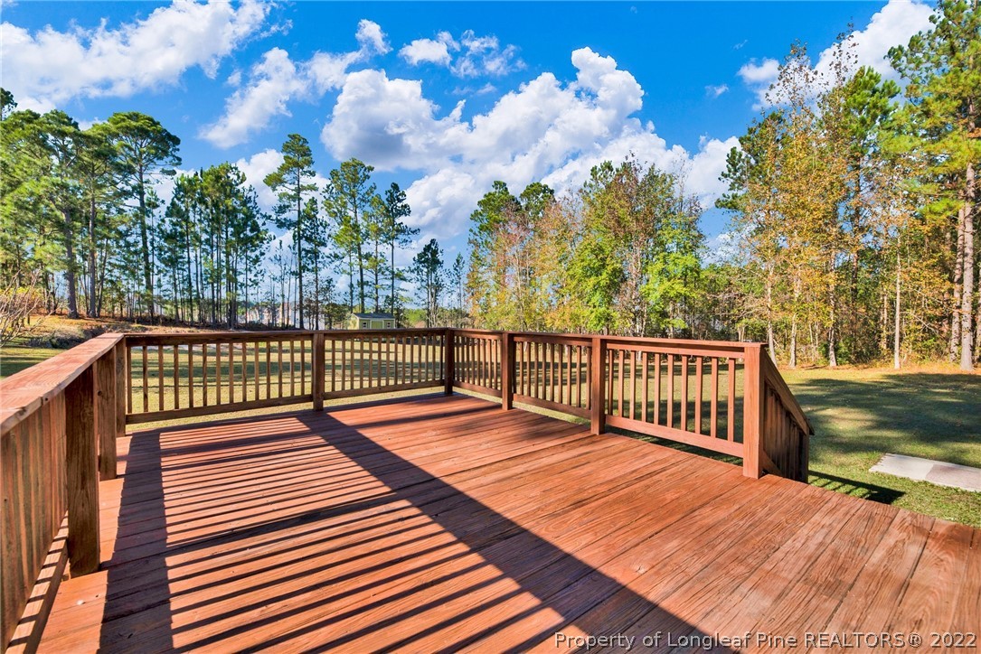 365 Sawyer Road Cameron, NC 28326 - Photo 33 of 37 a balcony with wooden floor and fence