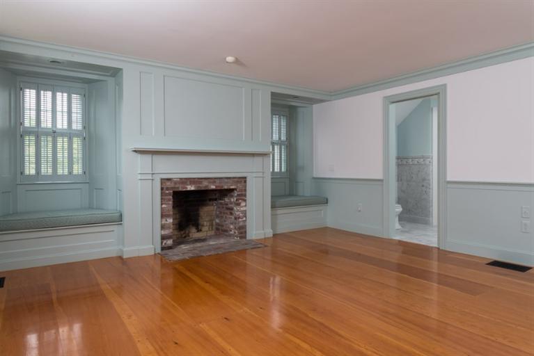 154 Shore Road Chatham, MA 02633 - Photo 12 of 14 a view of empty room with wooden floor and fireplace