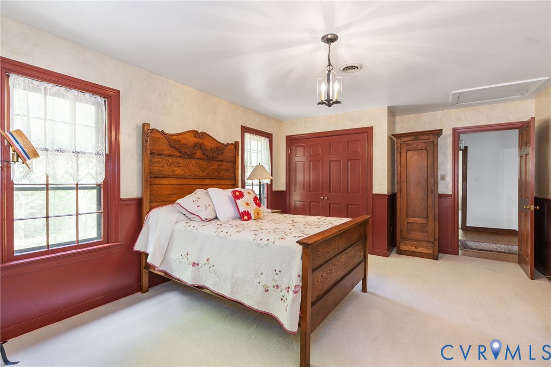 7381 McClellan Road Mechanicsville, VA 23111 - Photo 36 of 66 Room featuring neutral carpeting, red wainscoting,