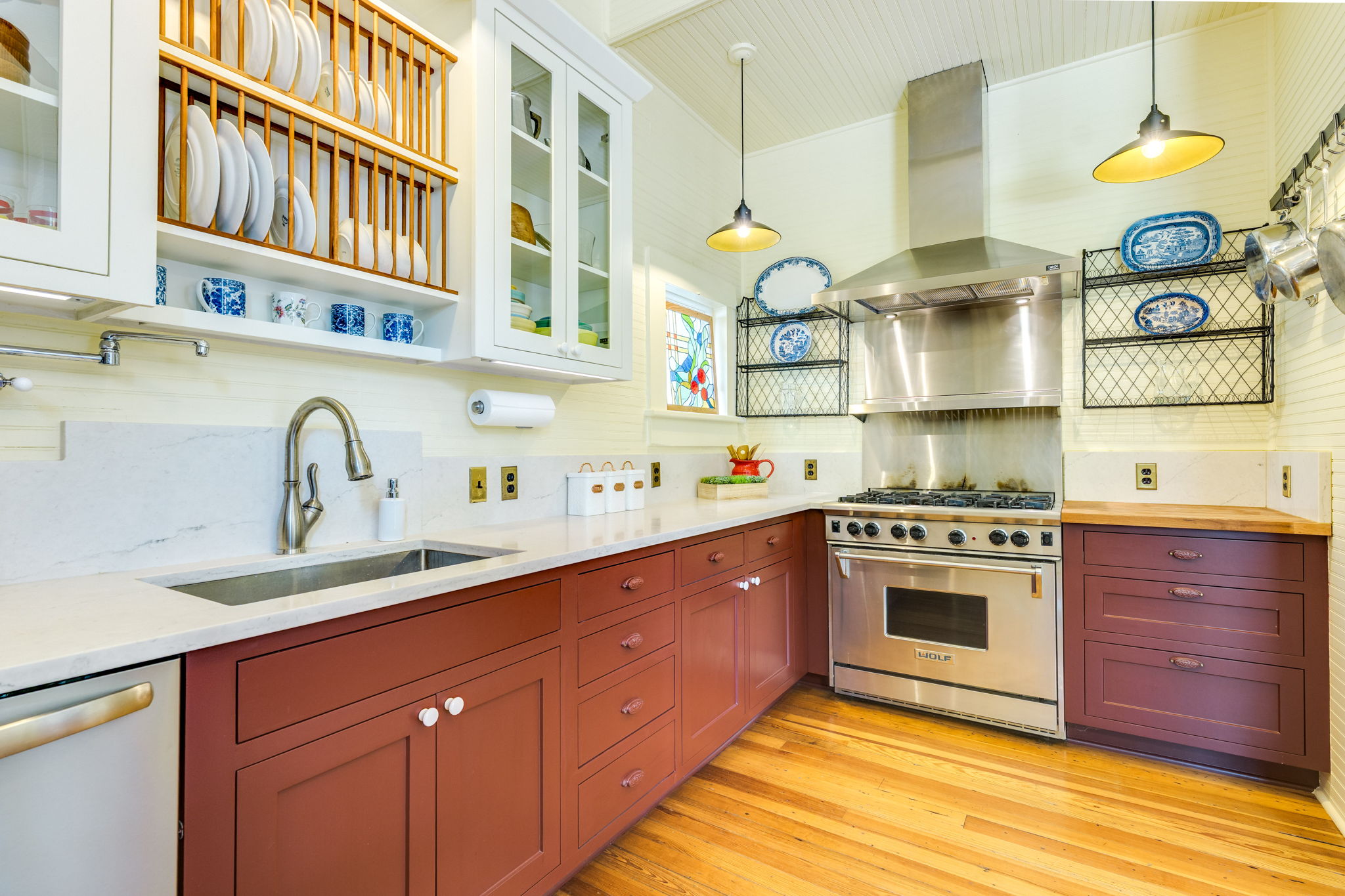 3908 Avenue D Austin, TX 78751 - Photo 14 of 26 a kitchen with stainless steel appliances granite countertop a sink stove and cabinets