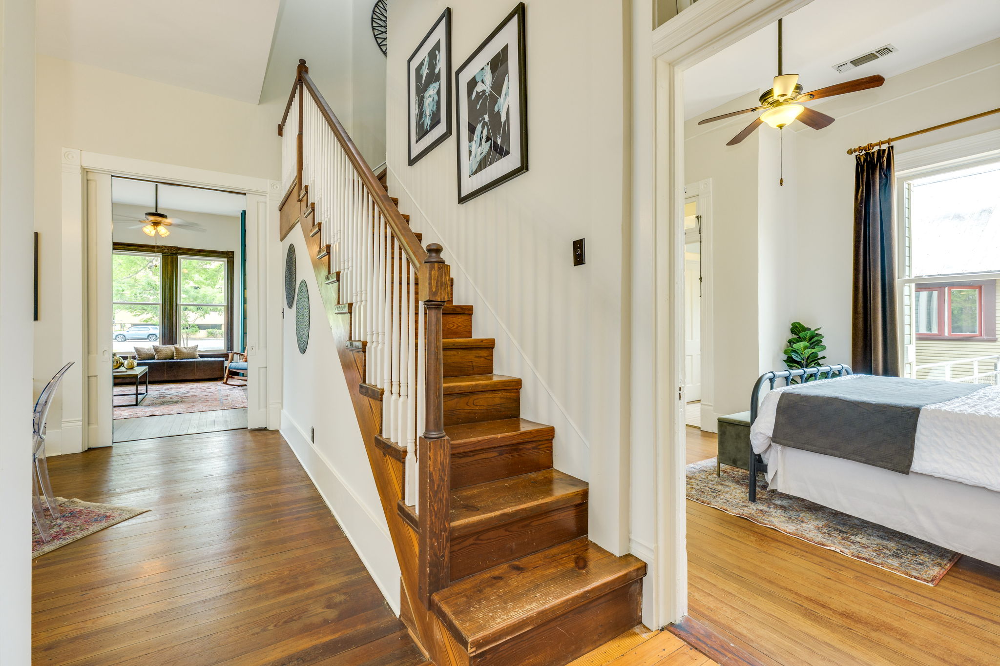 3908 Avenue D Austin, TX 78751 - Photo 25 of 26 a view of a livingroom with furniture stairs wooden floor and windows