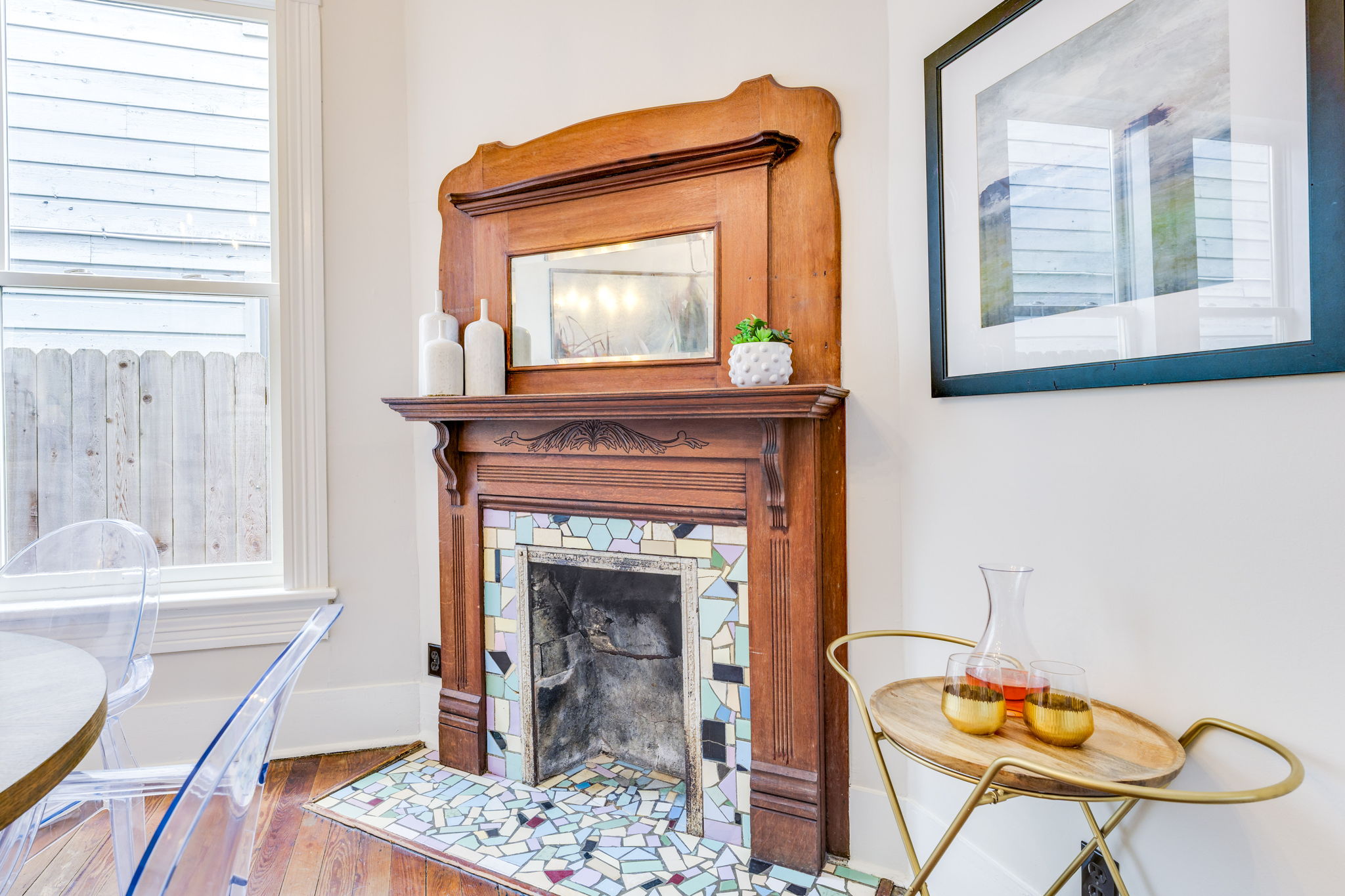 3908 Avenue D Austin, TX 78751 - Photo 9 of 26 a living room with a fireplace a flat screen tv and a table