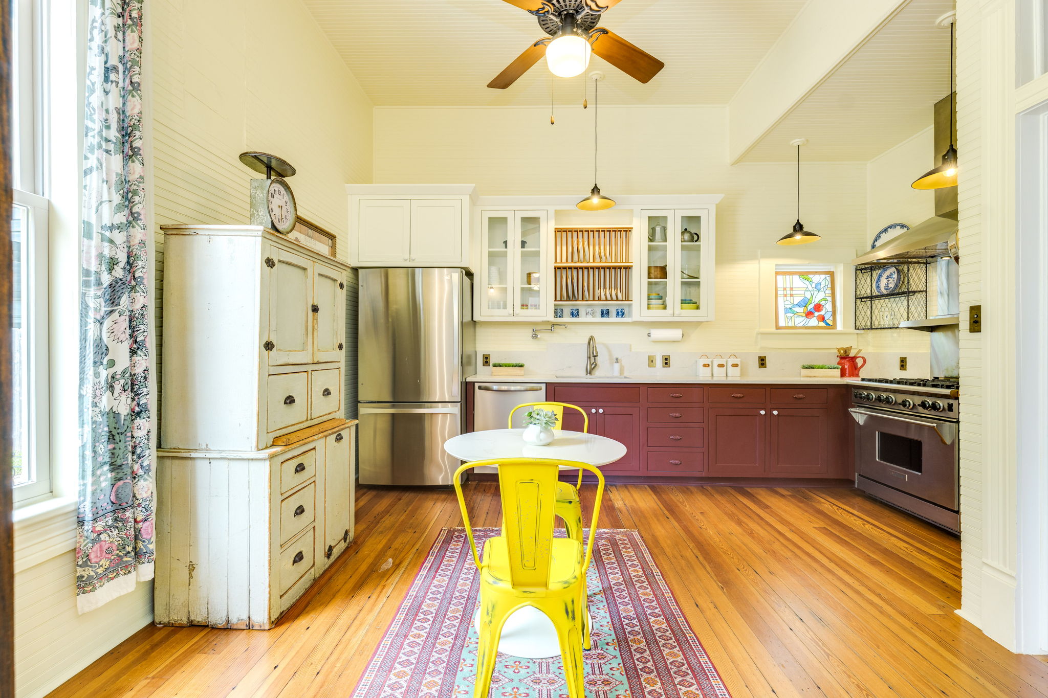 3908 Avenue D Austin, TX 78751 - Photo 10 of 26 a kitchen with stainless steel appliances granite countertop a stove refrigerator and cabinets